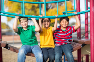 three boys on a playground