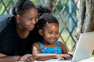 Mother and daughter using a computer