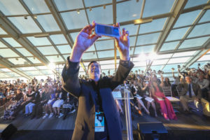 funder taking selfie with audience