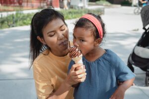 mom with daughter and ice cream