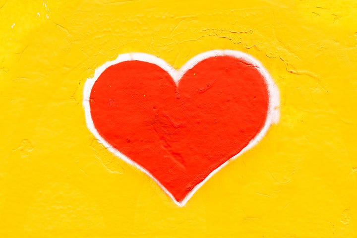 Red heart on yellow background