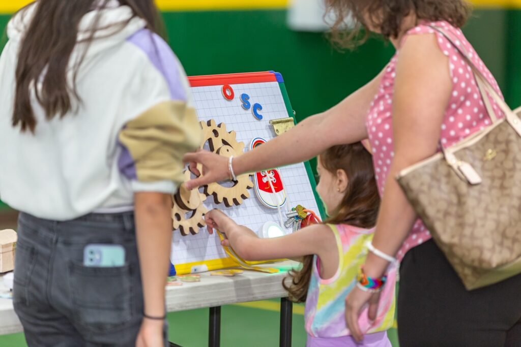 family doing activity at Orlando Science Center