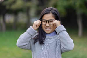 girl smiling with glasses
