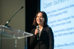 woman smiling on stage