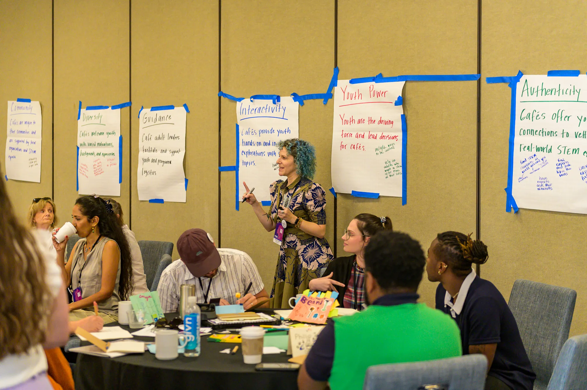 girl presents in front of group