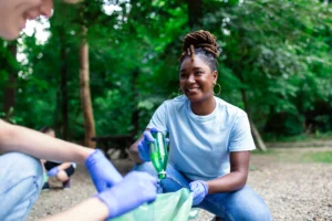 girl cleaning up trash