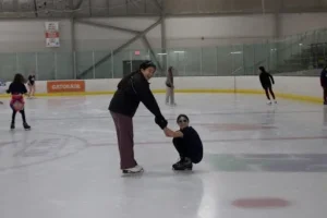 girls ice skating together